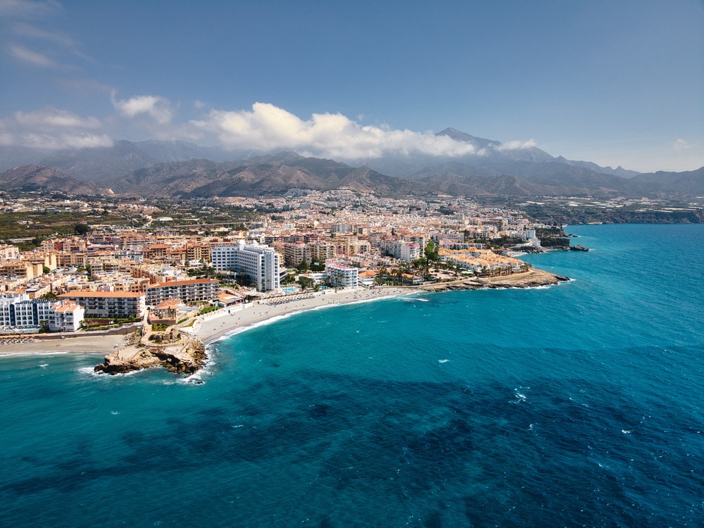 Aerial photo of a coastal city and beach (image quality sample)