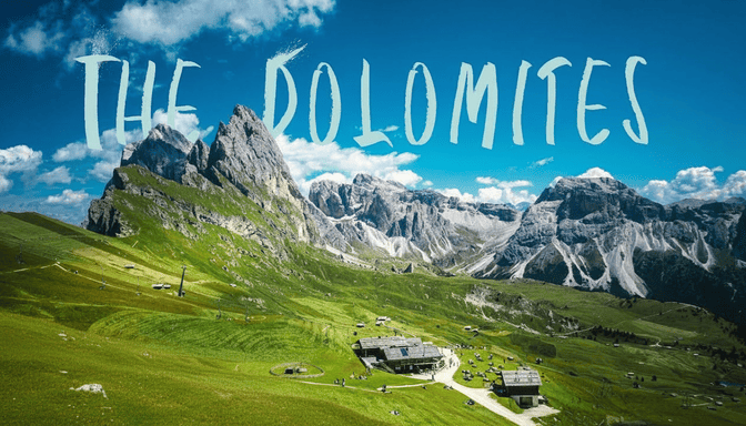 Aero Timelapse Studio Dolomites drone video thumbnail Italian Alps jagged peaks green meadows alpine huts UNESCO World Heritage aerial cinematography