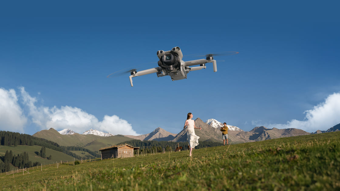 DJI Mini 5 Pro Review: travel drone flying over mountains