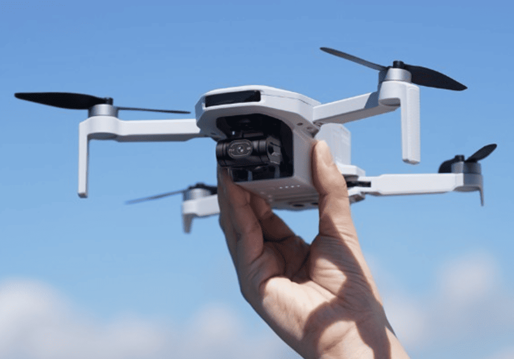 best drones for beginners 2026: Potensic Atom drone being launched from hand